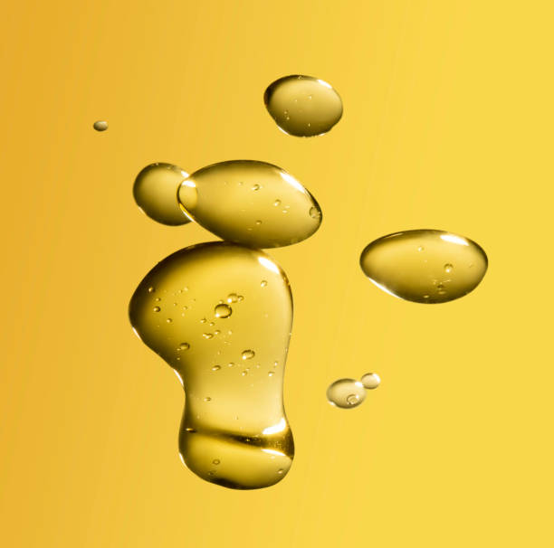 istock golden yellow bubble oil droplet, abstract background 1163527070