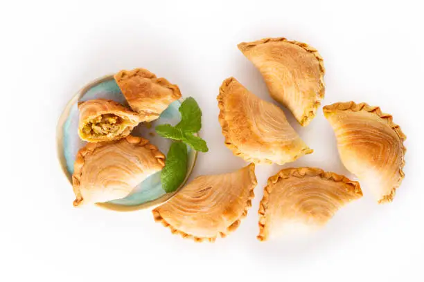 Photo of South east Asia origin food concept homemade chicken Curry puffs on white background with copy space