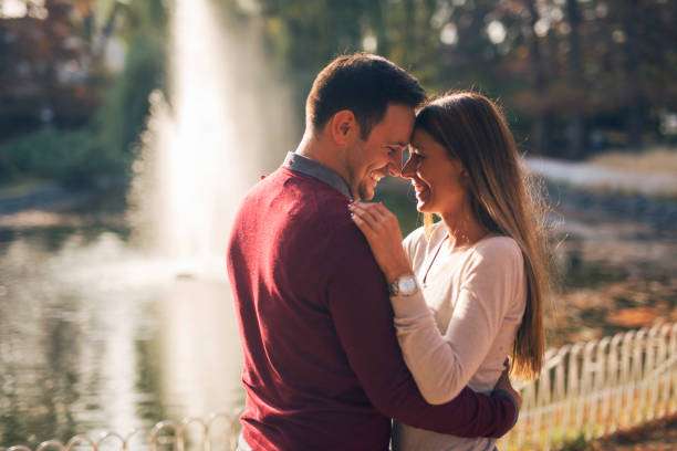 istock Romantic couple at public park 1163527768