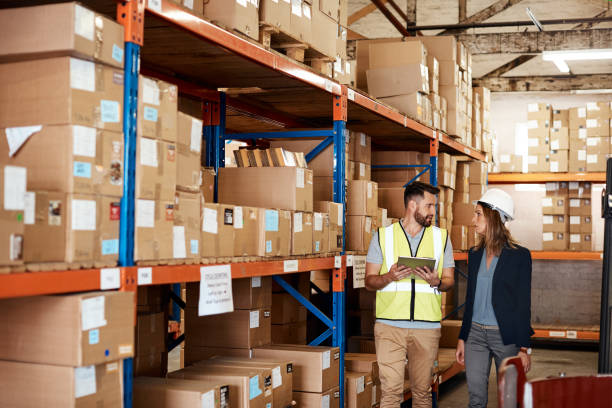 istock Taking note of every box in the warehouse 1163527976