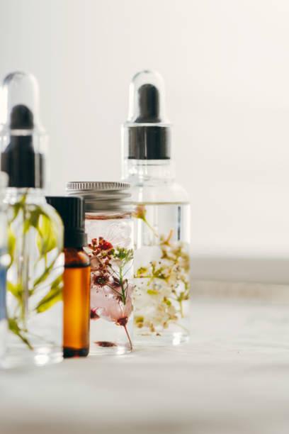 istock Transparent Bottles of essential oil with fresh herbs. 1163531177