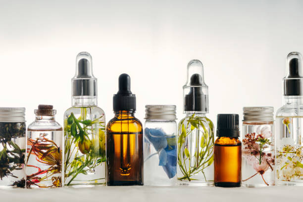 istock Transparent Bottles of essential oil with fresh herbs. 1163531190