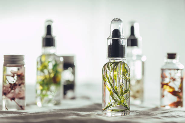 istock Transparent Bottles of essential oil with fresh herbs. 1163531192