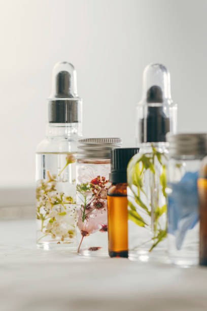 istock Transparent Bottles of essential oil with fresh herbs. 1163531301