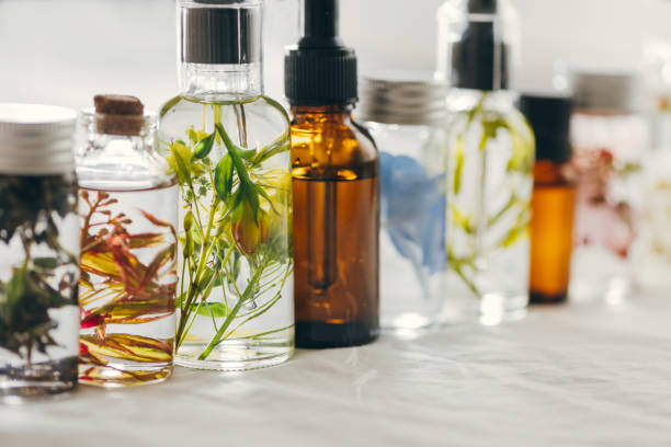 istock Transparent Bottles of essential oil with fresh herbs. 1163531364
