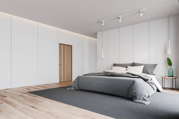istock White master bedroom corner with door 1163534393