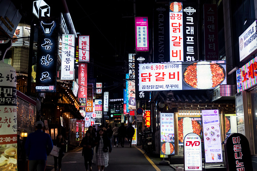 Neons, lights and people in the street, night scene in a gangnam-gu street, Seoul, South Korea