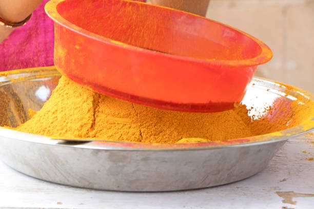 istock Turmeric powder getting refined at home by manual process 1163535277