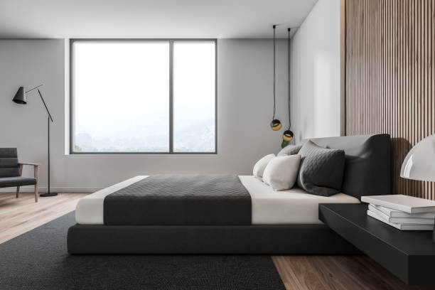 istock Side view of white and wooden bedroom 1163536085
