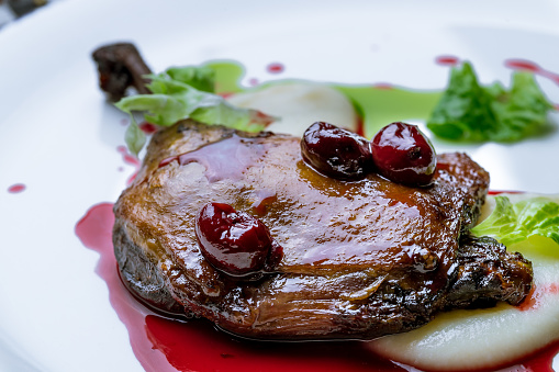 Duck leg confit with berry sause