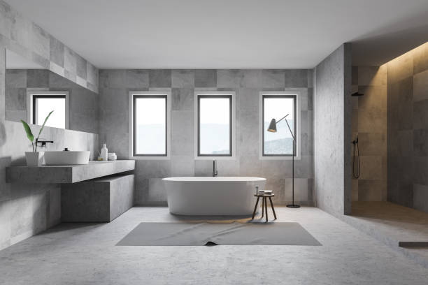 istock Gray tile bathroom interior, tub, sink and shower 1163536159