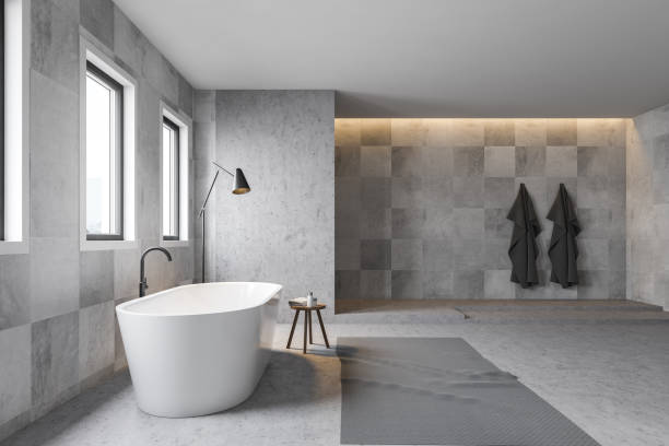 istock Gray tile bathroom interior, tub and shower 1163536231