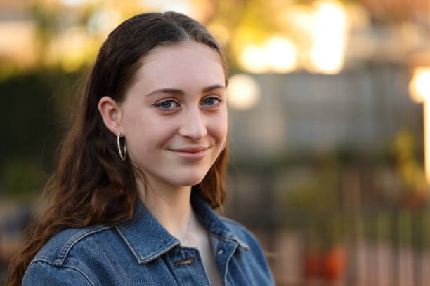 istock Smiling young woman in the afternoon sun 1163536310