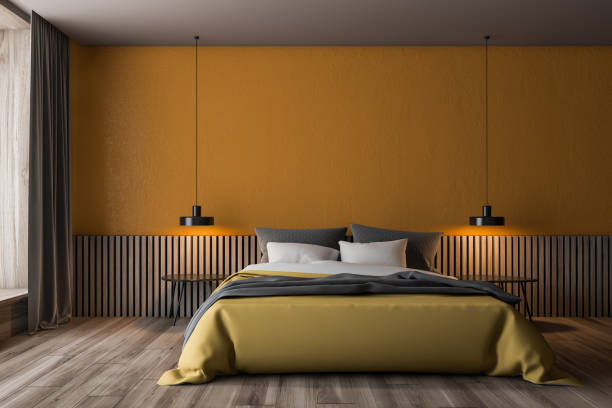 istock Orange and wooden bedroom interior 1163536721