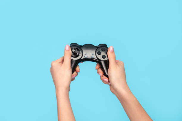 istock Crop woman playing game with gamepad 1163537631