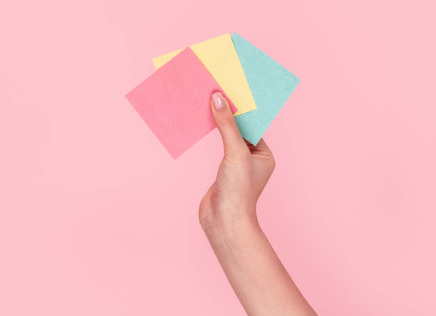 istock Crop hand with set of sticky notes 1163537678