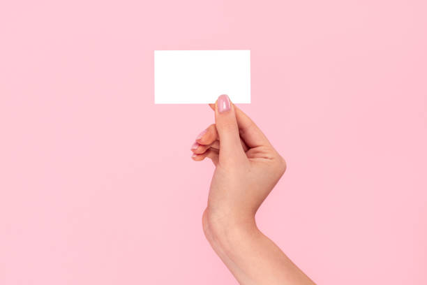 istock Crop hand with empty business card 1163537684