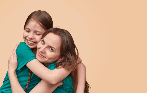 istock Embracing happy woman and daughter 1163538722