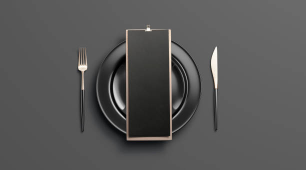 Blank black cafe menu mockup on plate with cutlery, isolated Blank black cafe menu mockup on plate with cutlery, isolated, 3d rendering. Empty tableware with checklist mock up, top view. Clear booklet on wooden holder for breakfast or lunch template. restaurant table card stock pictures, royalty-free photos & images