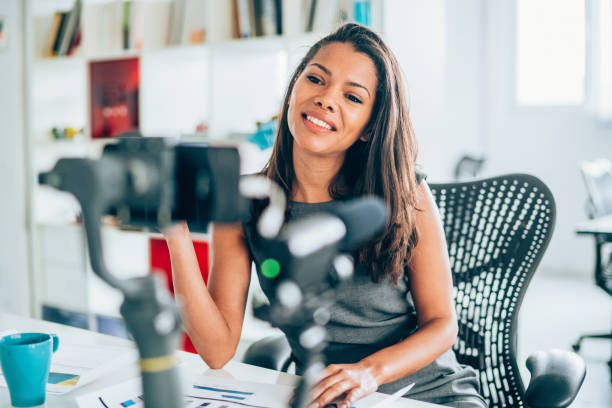 istock Businesswoman vlogging at the office 1163539325