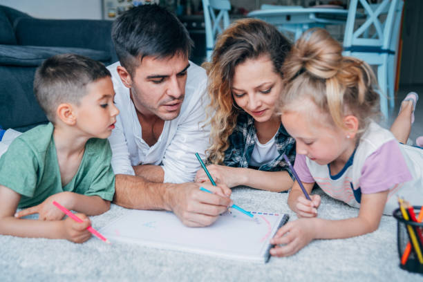 istock Young happy family drawing 1163539431