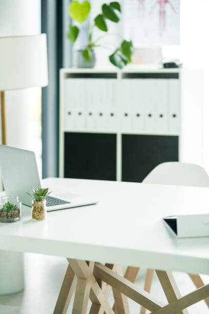 Helping you get the job done Still life shot of an empty doctor's office inside a hospital neat office stock pictures, royalty-free photos & images