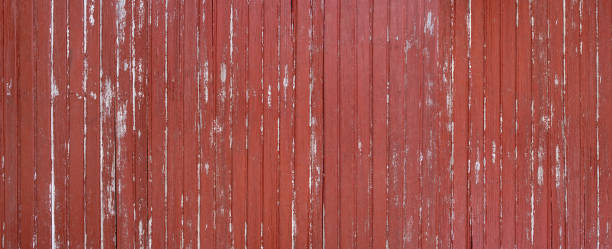 istock Weathered red brown wooden wall panorama 1163540402