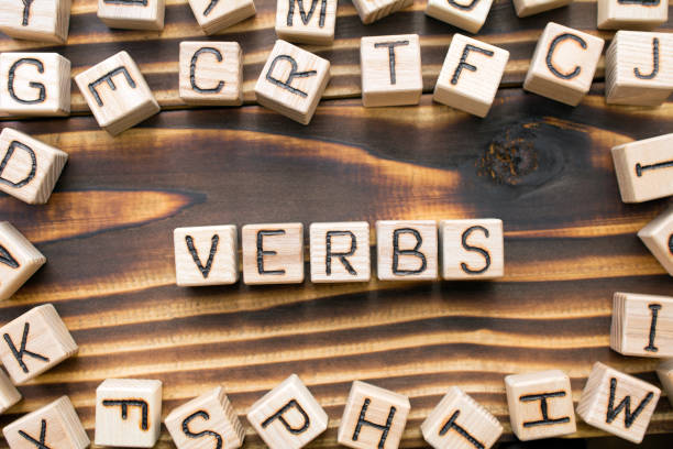 istock word verbs composed of wooden cubes 1163543287