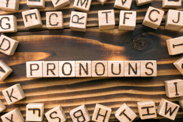 word pronouns composed of wooden cubes stock photo