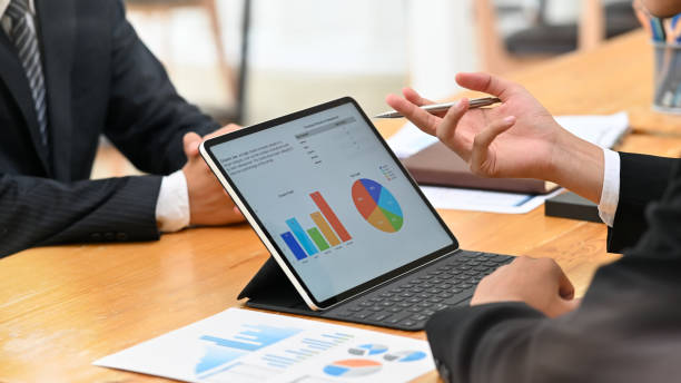 istock Two businessman meeting and consult with digital portable computer on table. 1163544619