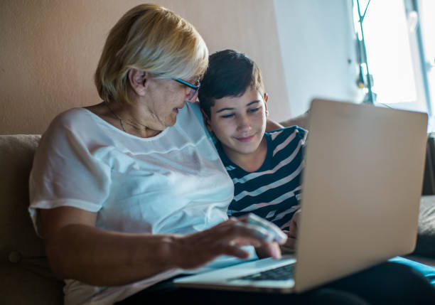 istock Grandmother and grandson using tehnology 1163544638