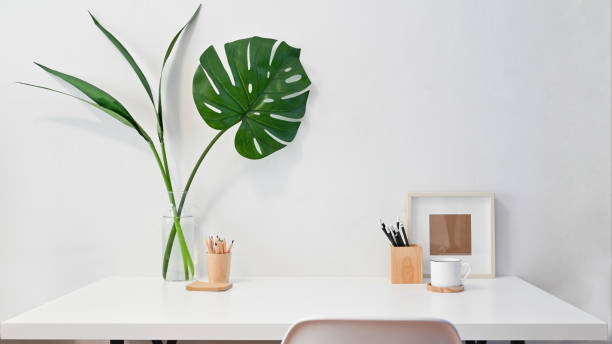 istock Workspace creative desk photo frame, coffee, pencil with plant decoration. 1163544704