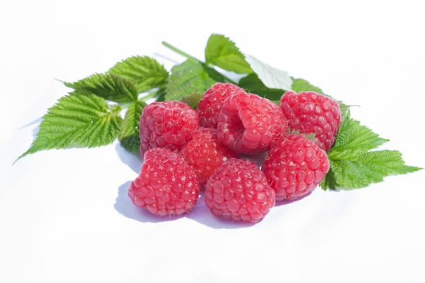 istock Fresh organic ripe raspberries with green leaf isolated on white background macro 1163544923
