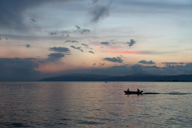 istock boat on a lake at sunset 1163545451