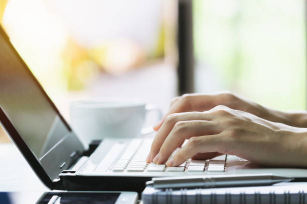 istock Closeup hand of woman using computer  for business, working concept in office. 1163546064