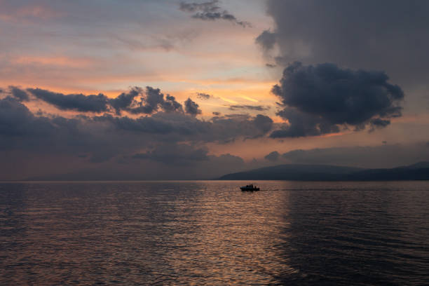 istock boat on a lake at sunset 1163546076