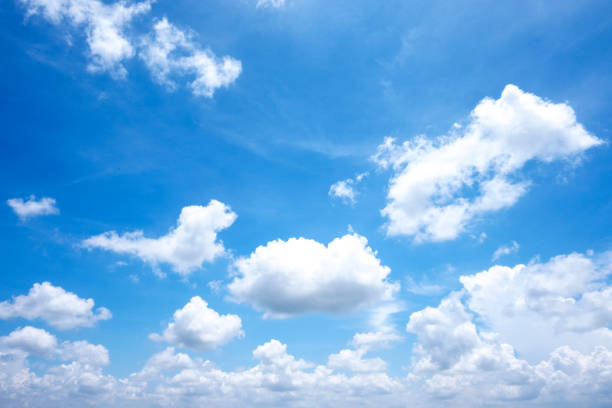 istock Beautiful white clouds with sun on blue sky.Color shade gradient from white to blue for background wallpaper. 1163547334