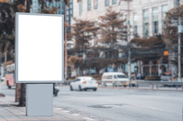 istock led blank billboard white screen side road in city. ad mockup copy space for advertising banner near bus stop in metropolis. 1163548353