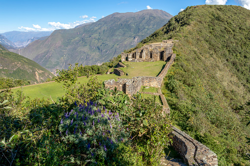 Choquequirao ancient architectural site, archaeological complex : The ruins of buildings and terraces at levels above and below Sunch'u Pata, the truncated hill top, southern Peru, South America