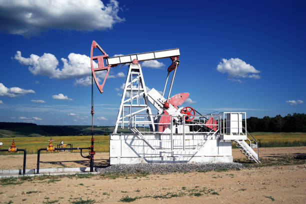 istock Oil pump, field, blue sky 1163550298