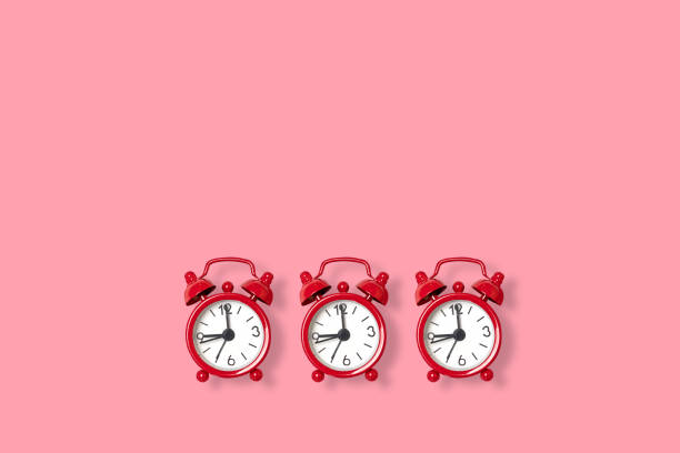 istock Flat lay retro beautiful new alarm clock on a pink background. Copy space 1163552130