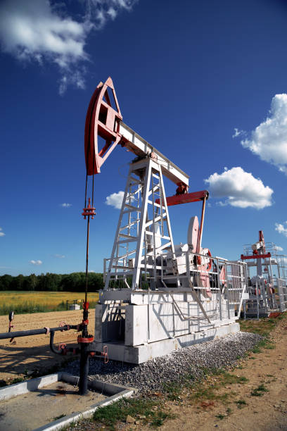 istock Oil pump, field, blue sky 1163553669