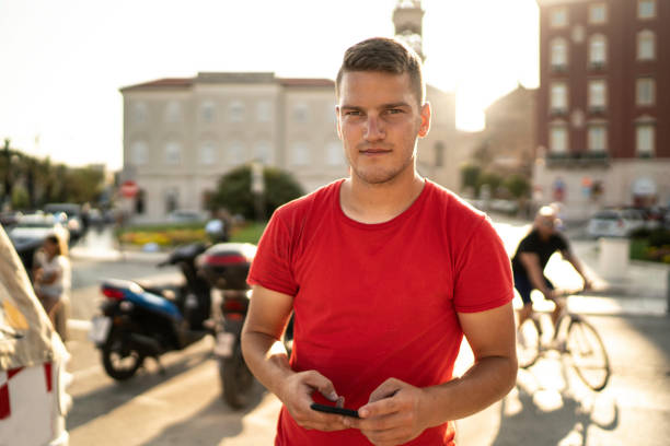 istock Portrait of a young man using smartphone 1163553842