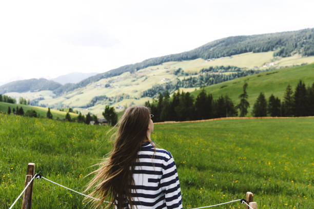 istock Woman enjoying summer in Dolomites Alps 1163555012