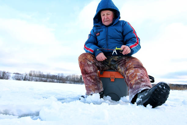 istock Fisherman Winter on the Lake 1163555820