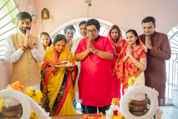 istock Multi Generation Family attending Prayers at a Hindu Temple 1163556588