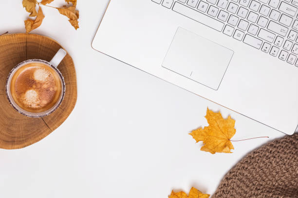 istock Autumn workplace concept with coffee and yellow leaves 1163556628