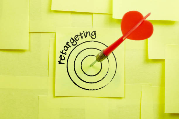 Hit The retargeting Target In Darts Game Concept On The Sticky Note Papers