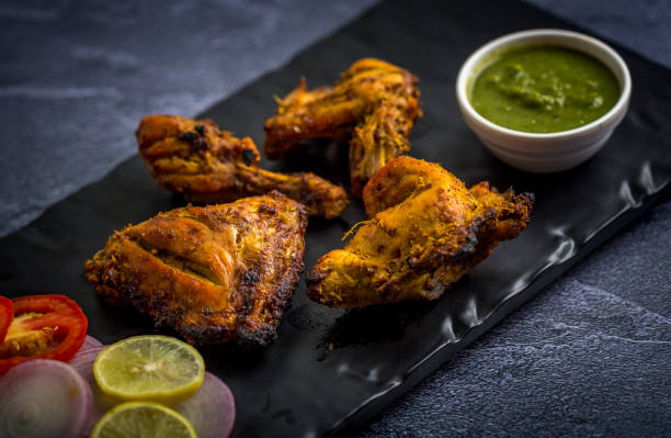 istock Tandoori Chicken with lemon and oninon 1163558518