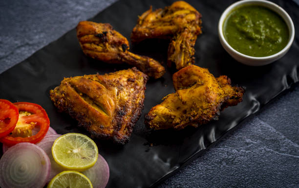 istock Tandoori Chicken with lemon and oninon 1163558572
